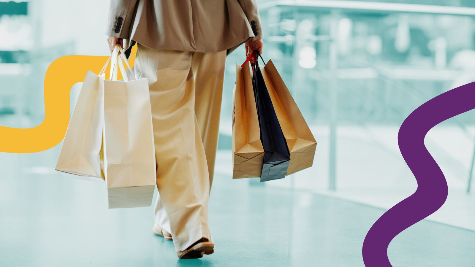 shopping close of a shopper (identity hiddeen) carrying shopping bags